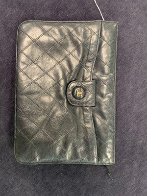 Lot 13 - A Chanel quilted black lambskin leather pochette, 1986-88