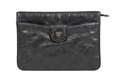 Lot 13 - A Chanel quilted black lambskin leather pochette, 1986-88