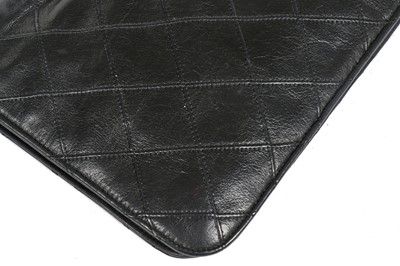 Lot 13 - A Chanel quilted black lambskin leather pochette, 1986-88
