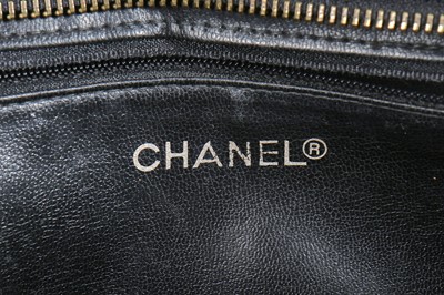 Lot 13 - A Chanel quilted black lambskin leather pochette, 1986-88
