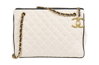 Lot 1 - A Chanel quilted canvas and navy lambskin leather bag, Spring-Summer 1991 ready-to-wear