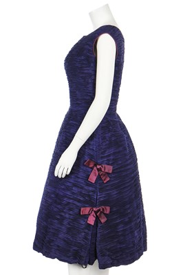 Lot 195 - A Sybil Connolly navy-blue pleated linen cocktail dress, model 'Simplicity', circa 1956