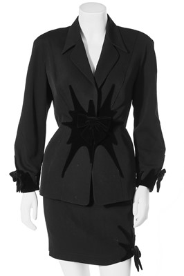 Lot 122 - A Thierry Mugler black wool suit with velvet 'starburst' and bows, late 1980s-early 1990s