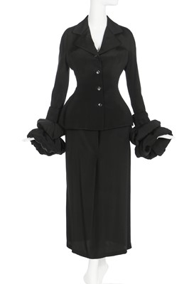 Lot 189 - A Yohji Yamamoto black silk suit with padded cuffs, 1990s