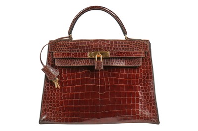 Lot 5 - An Hermès brown crocodile Kelly bag, late 1960s