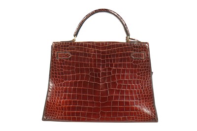 Lot 5 - An Hermès brown crocodile Kelly bag, late 1960s