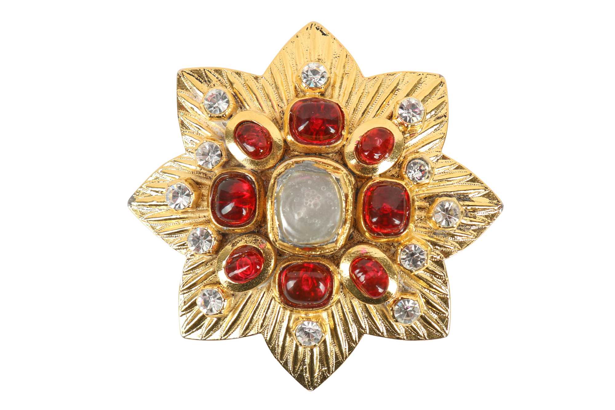 Lot 20 - A Chanel gilt eight-pointed flower-head-shaped brooch, 1985