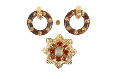 Lot 20 - A Chanel gilt eight-pointed flower-head-shaped brooch, 1985
