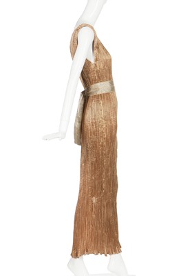 Lot 58 - A Mariano Fortuny pale-gold pleated silk Delphos gown, 1920-30