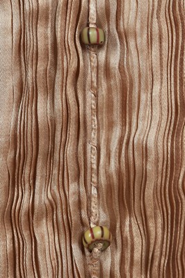 Lot 58 - A Mariano Fortuny pale-gold pleated silk Delphos gown, 1920-30