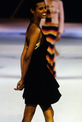 Lot 196 - A Moschino cocktail dress with gold-sequined 'Peace' sign halter-neck bodice, Spring-Summer 1994