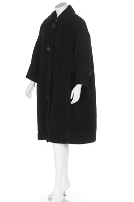 Lot 83 - A Christian Dior by Yves Saint Laurent couture black wool tent coat, 1958-60