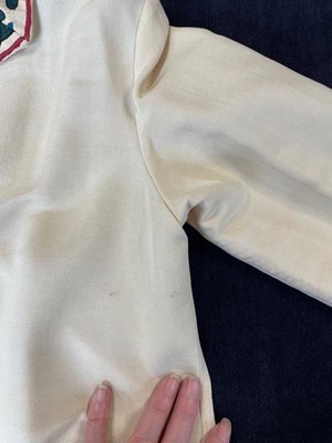 Lot 65 - An ivory silk summer coat made from a Central Asian embroidered suzani, circa 1928