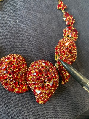 Lot 24 - A Dior necklace of faceted 'ruby' rhinestones set in a gilt metal mount, 1962