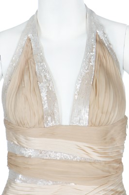 Lot 252 - A Versace pale gold chiffon 'Donna' evening gown, Autumn-Winter 2006