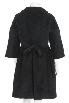 Lot 87 - An American licensed copy of a Balenciaga black wool coat, circa 1960