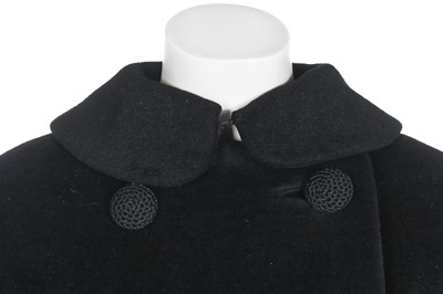 Lot 87 - An American licensed copy of a Balenciaga black wool coat, circa 1960