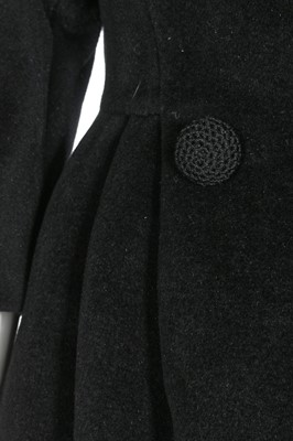 Lot 87 - An American licensed copy of a Balenciaga black wool coat, circa 1960