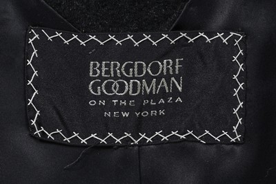 Lot 87 - An American licensed copy of a Balenciaga black wool coat, circa 1960