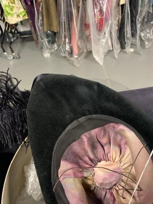 Lot 235 - A Vivienne Westwood black velvet hat with tulle veil to rear, circa 2008