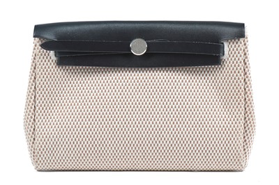 Lot 130 - An Hermès Herbag pochette, modern