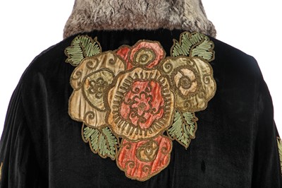 Lot 233 - A floral appliquéd black velvet opera coat, early-1920s
