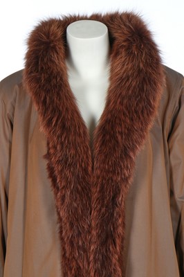 Lot 122 - An Yves Saint Laurent fur-lined raincoat, circa 1989