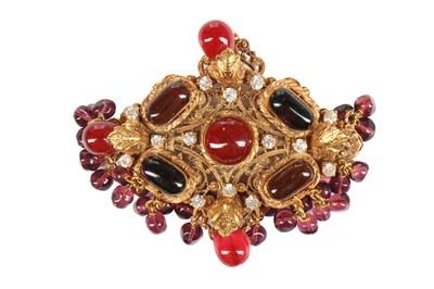 Lot 147 - A Chanel gilt brooch/pendant inset with cabochon glass 'rubies', 1970s
