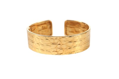 Lot 49 - A Gucci 18K gold cuff-bracelet, 1980s