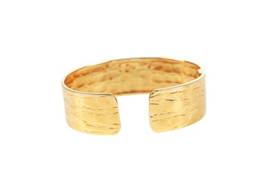 Lot 49 - A Gucci 18K gold cuff-bracelet, 1980s