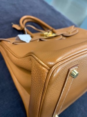 Lot 70 - An Hermès golden-brown clemence leather Birkin 35, 2001