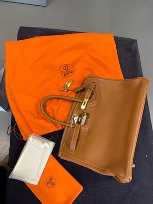 Lot 70 - An Hermès golden-brown clemence leather Birkin 35, 2001