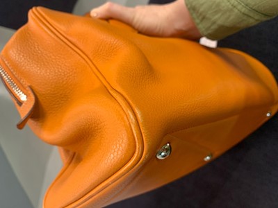 Lot 72 - An Hermès orange clemence leather Victoria II 35, 2007