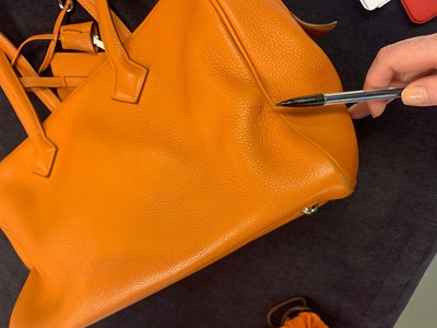 Lot 72 - An Hermès orange clemence leather Victoria II 35, 2007