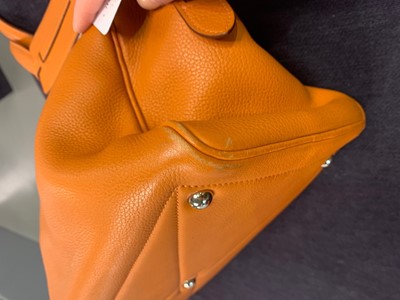 Lot 72 - An Hermès orange clemence leather Victoria II 35, 2007