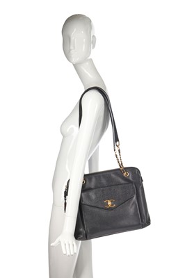 Lot 8 - A Chanel black caviar leather handbag with envelope pocket to front, 1990s