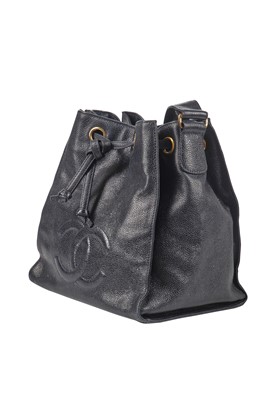 Lot 15 - A Chanel navy leather bucket bag with leather shoulder strap, 1994-1997