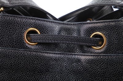 Lot 15 - A Chanel navy leather bucket bag with leather shoulder strap, 1994-1997