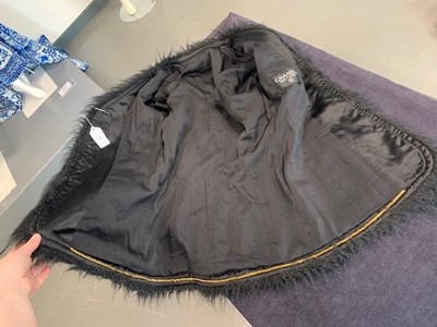 Lot 27 - A Chanel black bouclé wool single-breasted jacket, 1990s