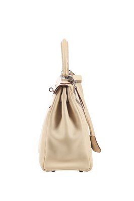 Lot 64 - An Hermès ecru leather Retourné Kelly, 2008