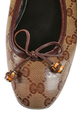 Lot 74 - A pair of Gucci monogrammed and embossed leather ballet pumps, 2010s