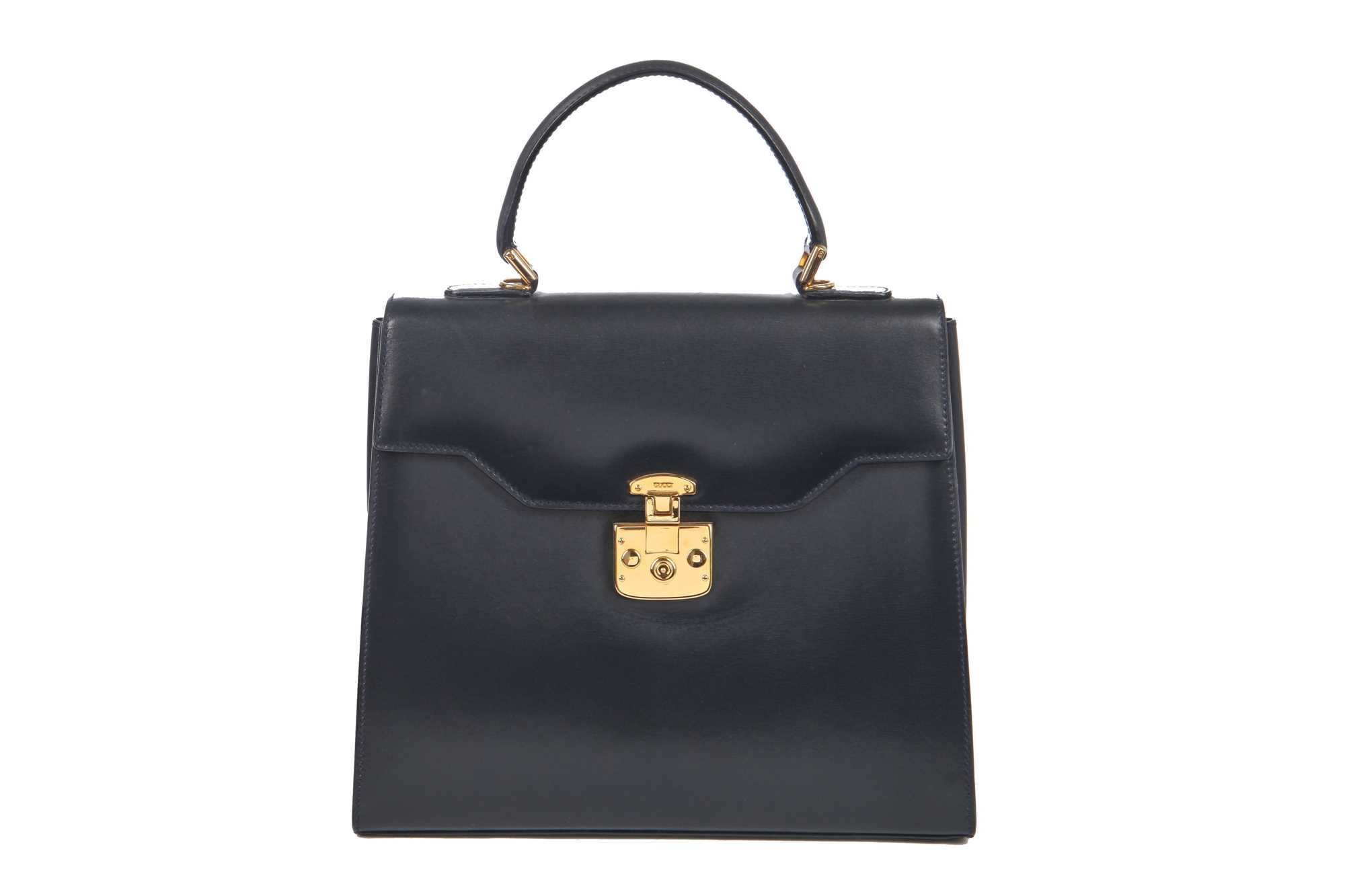 Lot 101 - A Gucci navy leather handbag, 1980s