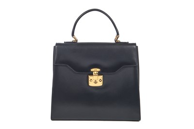Lot 101 - A Gucci navy leather handbag, 1980s