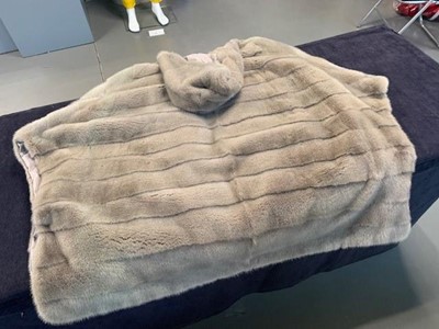 Lot 84 - A Loro Piana 'Kulm' white mink reversible poncho, modern