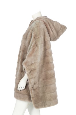 Lot 84 - A Loro Piana 'Kulm' white mink reversible poncho, modern