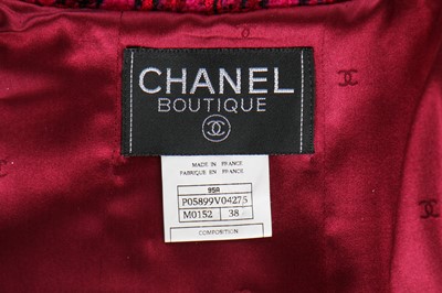 Lot 20 - A Chanel fuchsia-pink and black tweed suit, Autumn-Winter 1995-96