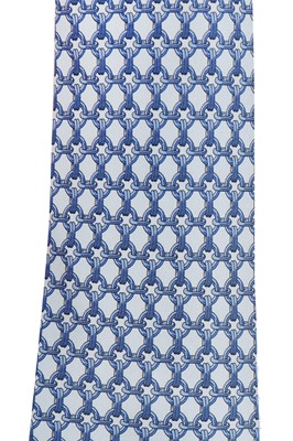 Lot 208 - Four Hermès printed silk ties in shades of blue and red, modern