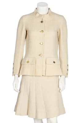 Lot 50 - A Chanel couture ivory tweed suit, 1968