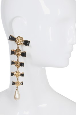 Lot 48 - A pair of Chanel enamelled gilt metal 'bow' clip-on earrings, circa 1984