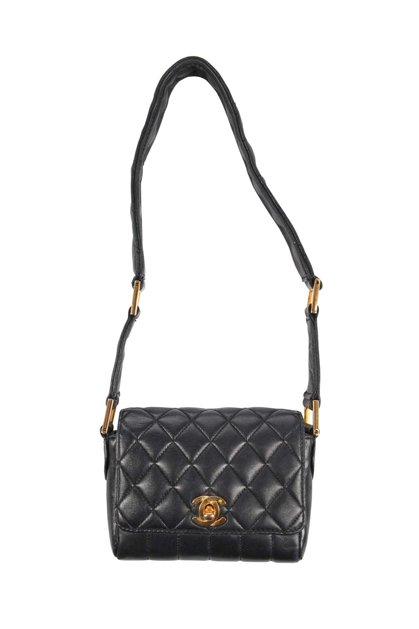 Lot 3 - A Chanel mini quilted navy lambskin leather flap bag, 1980s-early 1990s